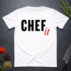 White t-shirt with 'CHEF it' text on a dark surface with kitchen items.