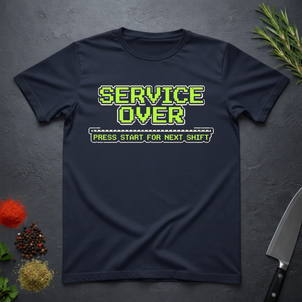 Navy Blue t-shirt with green text "Service Over-Press Start for Next Shift" on a dark surface.