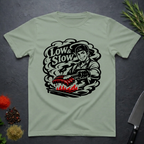 Sage Green t-shirt with 'Low & Slow' graphic design on a dark surface.