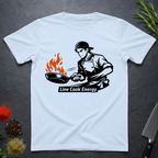 Light Blue t-shirt with a graphic of a chef and flames, labeled 'Line Cook Energy', on a dark surface.