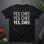Black t-shirt with 'YES CHEF. YES CHEF. YES, CHEF.' text on a dark surface.