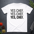 White t-shirt with 'YES CHEF. YES CHEF. YES, CHEF.' text on a dark surface.
