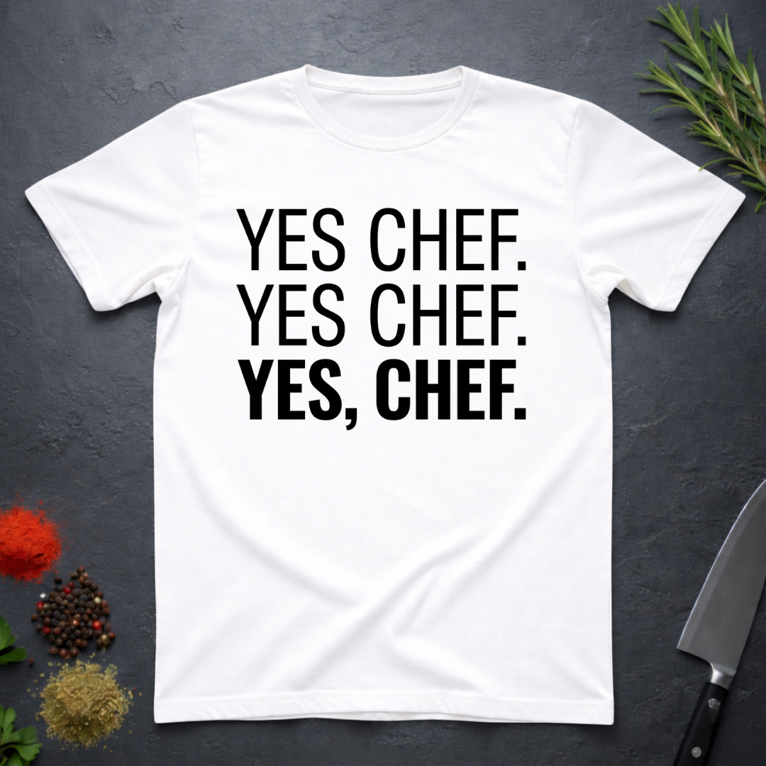 White t-shirt with 'YES CHEF. YES CHEF. YES, CHEF.' text on a dark surface.