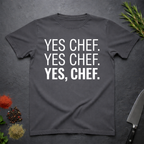 Charcoal Grey t-shirt with 'YES CHEF. YES CHEF. YES, CHEF.' text on a dark surface.