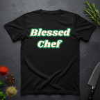 Black t-shirt with 'Blessed Chef' text on a dark surface with kitchen items.