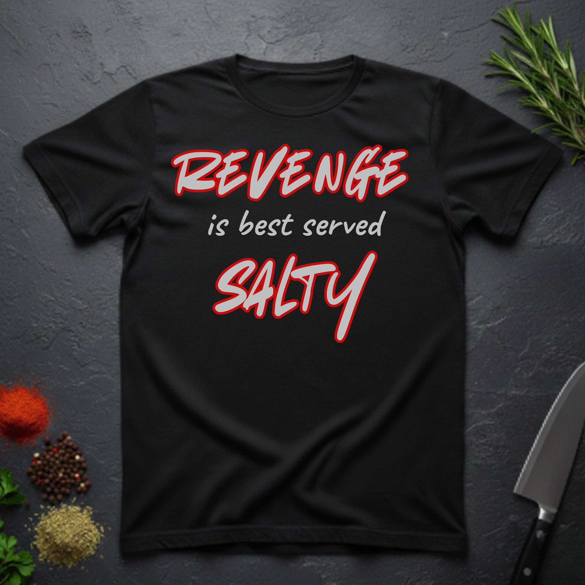 Black t-shirt with 'REVENGE is best served SALTY' text on a dark surface.