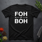Black t-shirt with 'FOH / BOH' text on a dark surface with decorative elements.