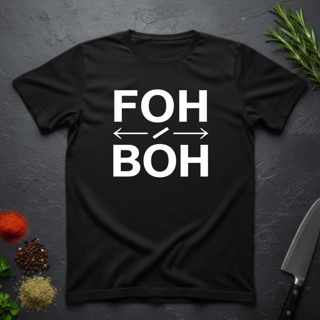 Black t-shirt with 'FOH / BOH' text on a dark surface with decorative elements.
