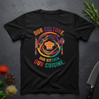Black t-shirt with colorful African graphic and text "Our Culture Our Kitchen, our Cuisine: on a dark surface.