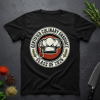 Black t-shirt with 'Certified Culinary Graduate Class of 2026' design on a dark surface with kitchen items.