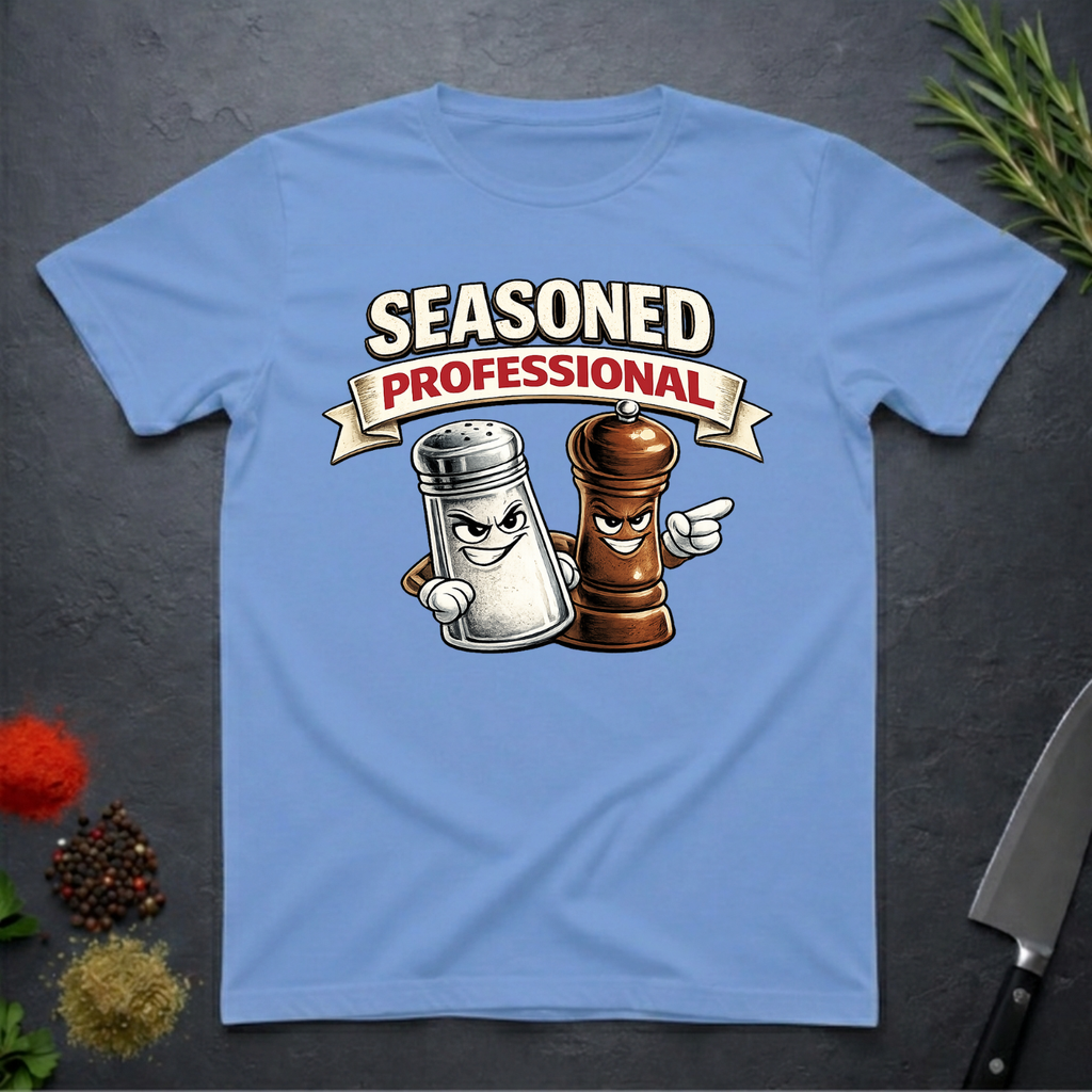Carolina Blue t-shirt with cartoon salt and pepper shakers and 'Seasoned Professional' text on a dark surface.