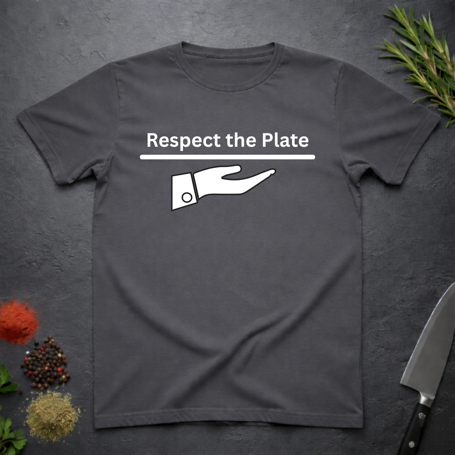 Charcoal Gray t-shirt with 'Respect the Plate' graphic on a dark surface with kitchen items.