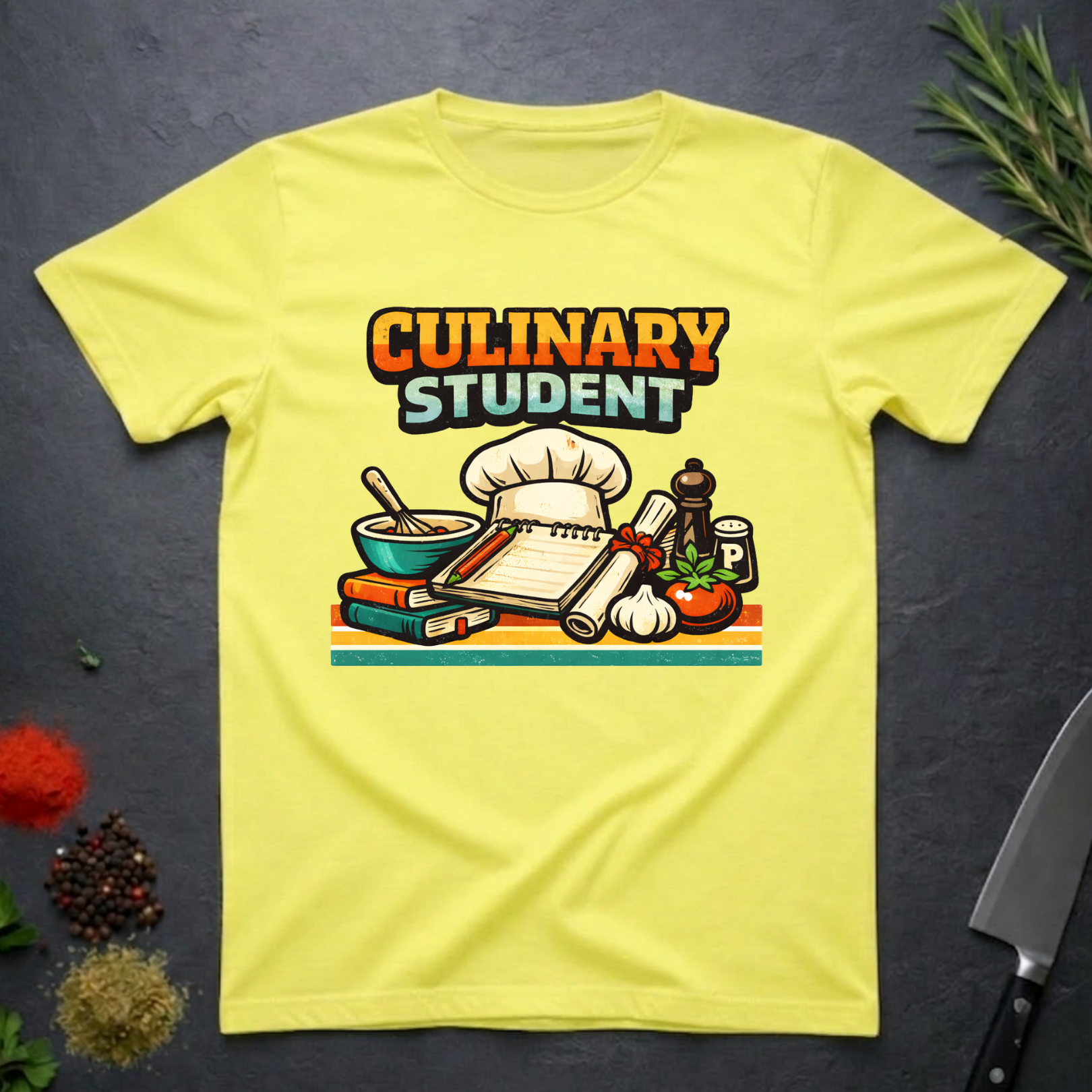 Cornsilk Yellow t-shirt with 'Culinary Student' graphic on a dark surface with kitchen items.