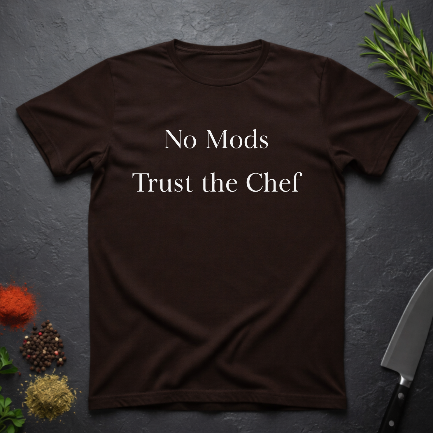 Chocolate Brown t-shirt with 'No Mods Trust the Chef' text on a dark surface with kitchen items.