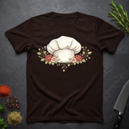 Chocolate Brown t-shirt with chef's hat and floral design on a dark surface
