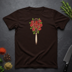 Chocolate brown t-shirt with a design of a whisk and roses as a bouquet on a dark surface.