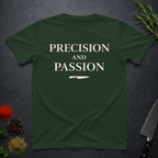 Forest Green t-shirt with 'PRECISION AND PASSION' text on a dark surface with decorative elements.
