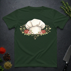 Forest Green t-shirt with a chef's hat and floral design on a dark surface.