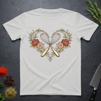 Ice grey t-shirt with a design of crossed kitchen utensils and flowers on a dark surface.