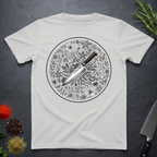 Ice grey t-shirt with a circular floral and knife design on a dark surface.