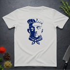 Ice Grey t-shirt with dark blue graphic chef face design on a dark surface with kitchen items.