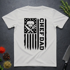 Ice Grey t-shirt with American flag and text 'CHEF DAD' design on a dark surface with kitchen items.