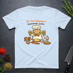 Light blue t-shirt with a cartoon chef and pasta graphic on a dark surface with text "My love language is homemade pasts" on a dark surface.