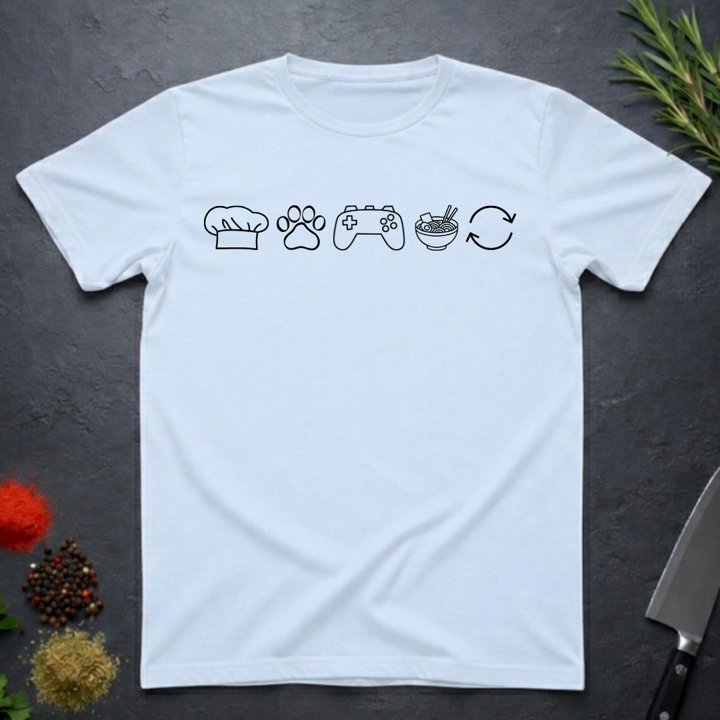 Light blue t-shirt with black icons of chef hat, paw print, game remote, ramen bowl and repeat symbol on a dark surface.