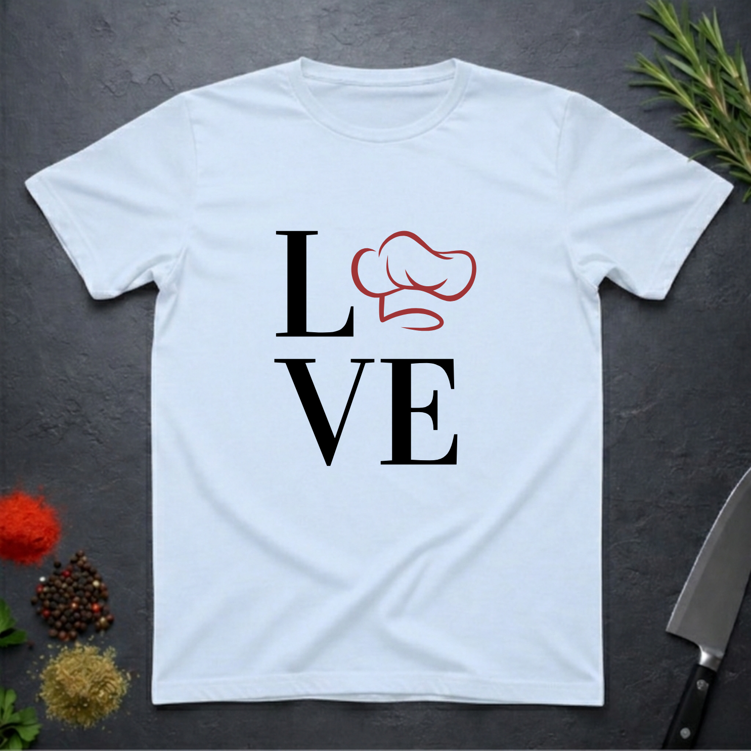 Light blue t-shirt with 'LOVE' design featuring a chef's hat as the letter O on a dark surface.