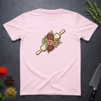 Light Pink t-shirt with a rolling pin and floral design on a dark surface.