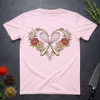 Light Pink t-shirt with a heart design featuring crossed whisks and flowers on a dark surface.