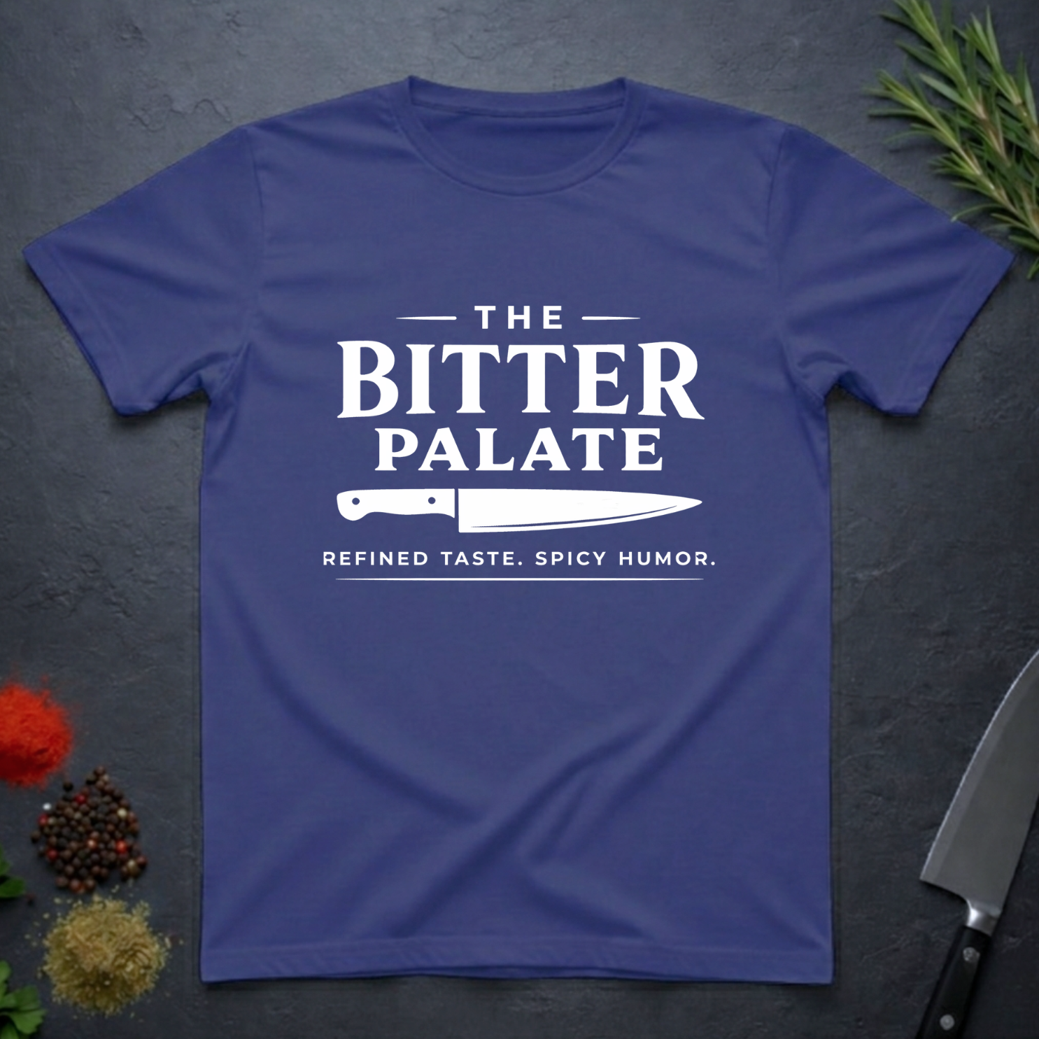 Metro Blue t-shirt with 'The Bitter Palate' logo on a dark surface with kitchen items.