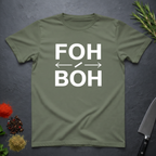 Military Green t-shirt with 'FOH / BOH' text on a dark surface with kitchen items.