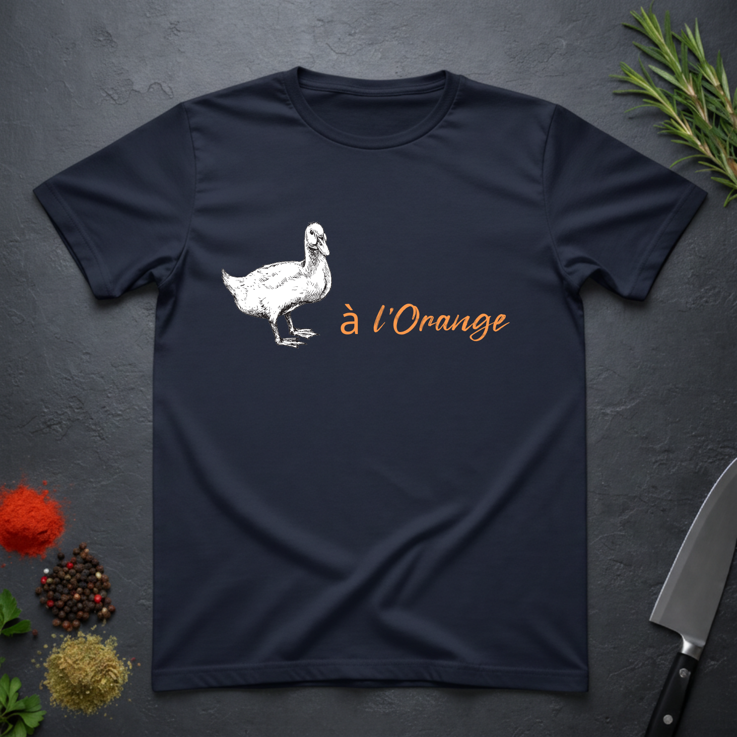 Navy blue with a white duck graphic and 'a l'Orange' text on a dark surface.