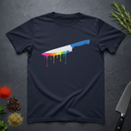 Navy blue t-shirt with a chef's knife with rainbow colored drip design on a dark surface.