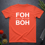 Bright Orange t-shirt with 'FOH / BOH' text on a dark surface with herbs and a knife.