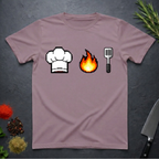 Paragon colored t-shirt with pixelated chef hat, fire, and spatula icons on a dark surface.