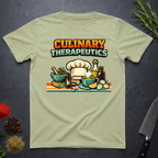 Pistachio green t-shirt with 'Culinary Therapeutics' graphic on a dark surface