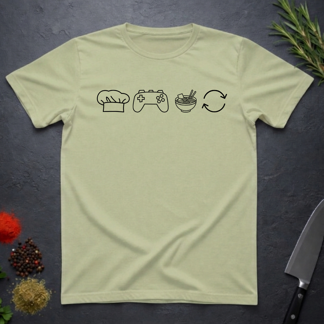 Pistachio green t-shirt with black icons of chef hat, game remote, ramen bowl and repeat symbol on a dark surface.