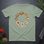 Sage green t-shirt with circular 'Global Cuisine' graphic design on a dark surface.