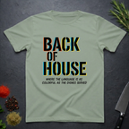Sage green t-shirt with 'Back of House' text on a dark surface with decorative elements.