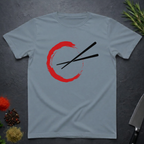 Stone blue t-shirt with red circle and black chopsticks design on a dark surface.