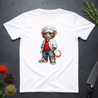 White t-shirt with a cartoon chef mouse design on a dark surface