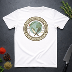 white t-shirt with circular graphic of a globe and text "A Chef Blends All Cultures" on a dark surface.