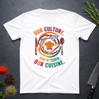 White t-shirt with colorful African graphic and text "Our Culture Our Kitchen, our Cuisine: on a dark surface.