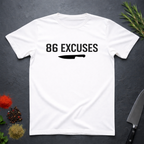 White t-shirt with '86 Excuses' and a knife graphic on a dark surface.