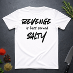 White t-shirt with 'REVENGE is best served SALTY' text on a dark surface.